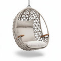 Woven hanging chair with cushion and wooden armrests for indoor outdoor use